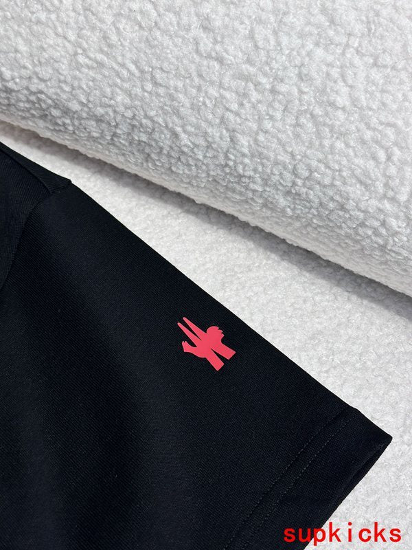 Flat lay presentation of Moncler luxury clothing with monogram-inspired silhouette