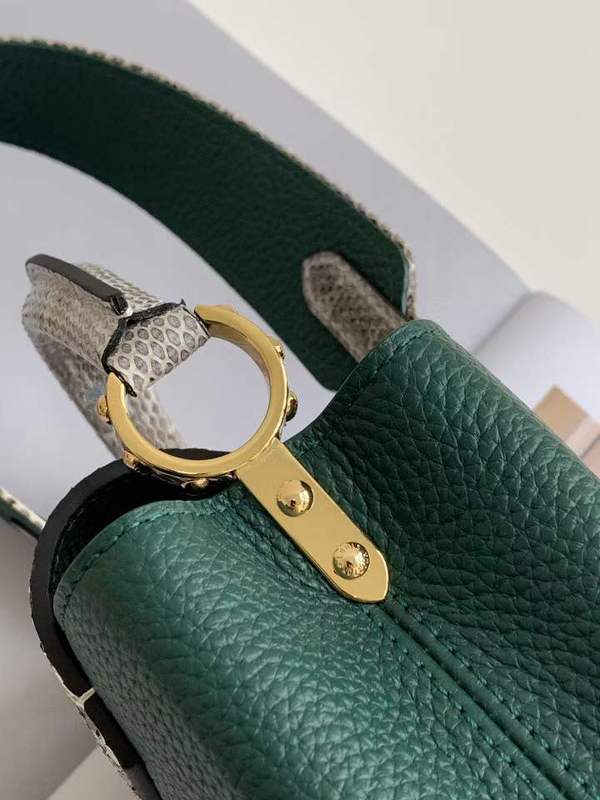 Handle and strap detail of structured everyday-luxe women's handbag – women's statement bag