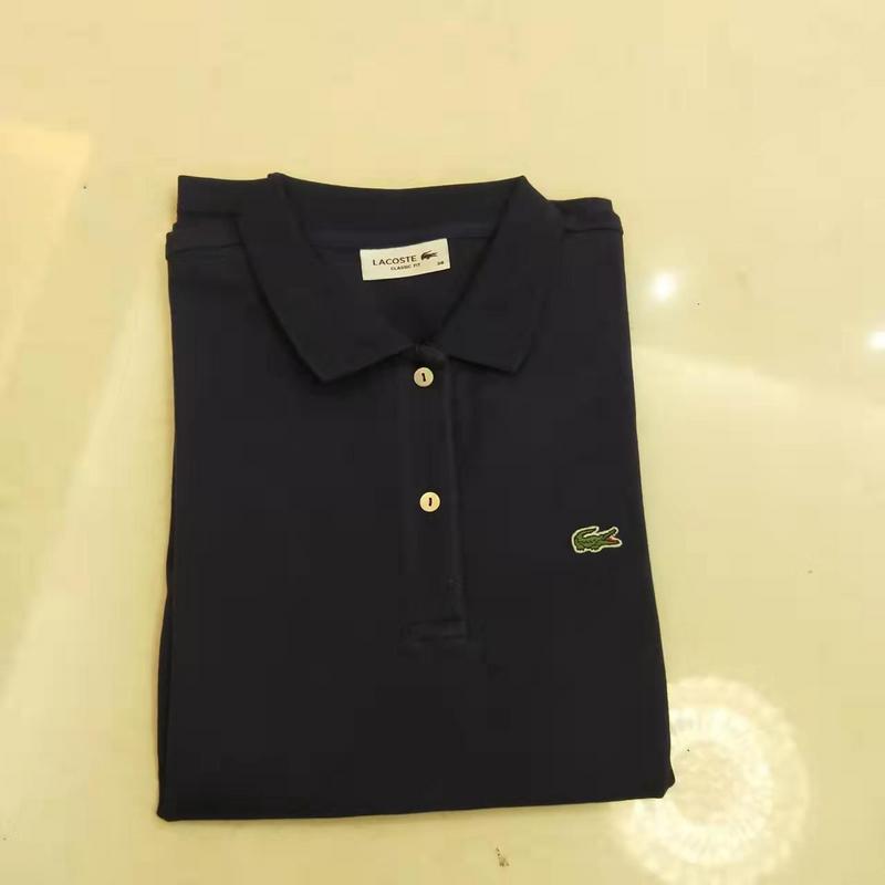 Full styled look of Lacoste luxury clothing with signature branding
