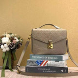 Front view of classic signature women's handbag – women's luxury accessory