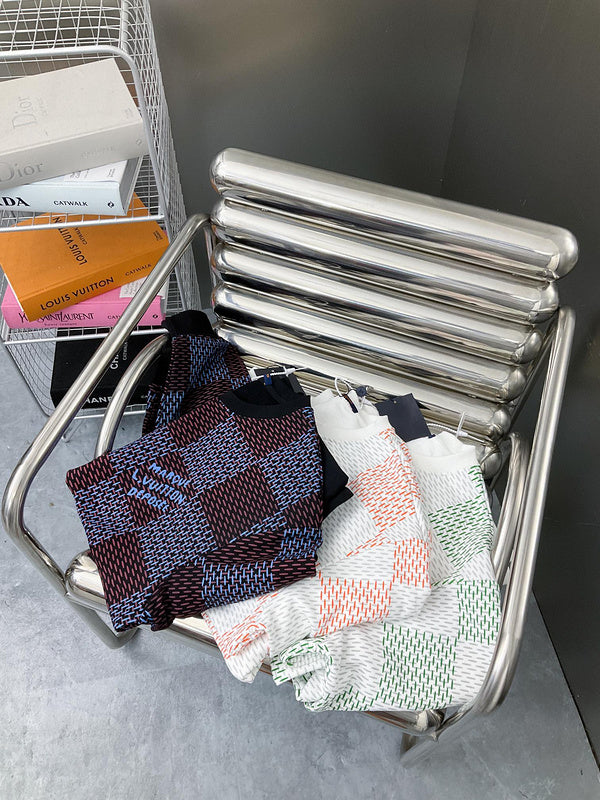 Close-up detail shot of Louis Vuitton luxury clothing with label-forward styling
