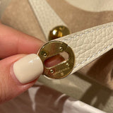 Side view of poised structured handbag