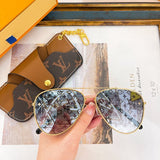 Close-up detail view of Louis Vuitton unisex sunglasses