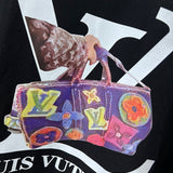 Flat lay presentation of Louis Vuitton luxury clothing with monogram-inspired silhouette