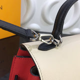 Back view of polished refined women's handbag – women's statement bag