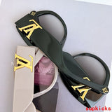 Close-up detail view of Louis Vuitton unisex sunglasses