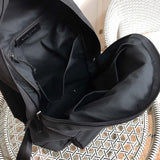 Close-up detail of structured sleek women's handbag – women's statement bag
