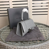 Styled lifestyle shot of signature chic women's handbag – women's luxury accessory