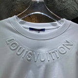 Flat lay presentation of Louis Vuitton cotton t-shirt with runway-inspired design