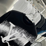 Close-up detail shot of Louis Vuitton luxury clothing with relaxed-fit cut