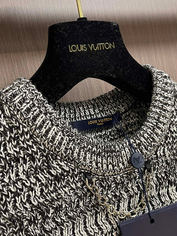 Close-up detail shot of Louis Vuitton luxury clothing with logo-detail design