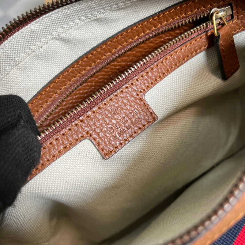 Side profile of classic polished women's handbag – women's everyday handbag