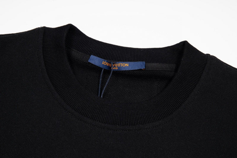 Flat lay presentation of Louis Vuitton luxury clothing with logo-detail design