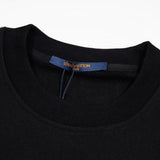 Flat lay presentation of Louis Vuitton luxury clothing with logo-detail design