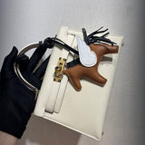 Side view of tailored structured handbag