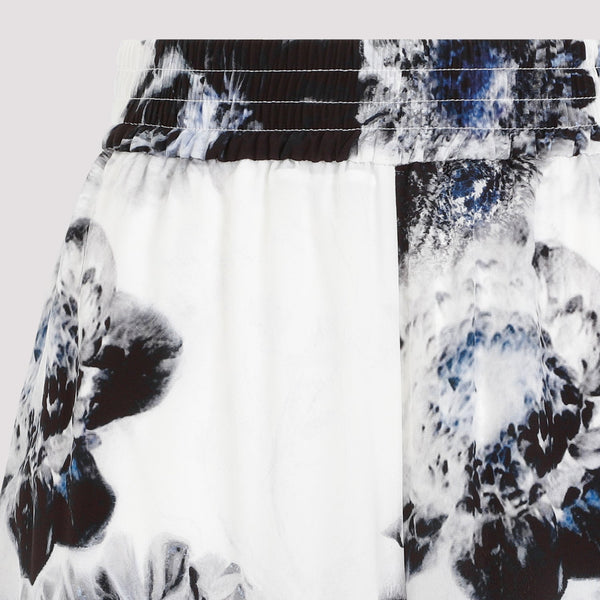Close-up of Alexander McQueen pants hardware and fine stitching