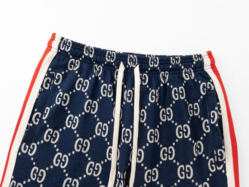 Flat lay presentation of Gucci luxury clothing with monogram-inspired silhouette