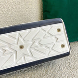 Styled lifestyle shot of modern polished women's handbag – women's luxury handbag