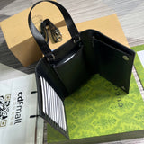 Side profile of polished classic women's handbag – women's luxury accessory