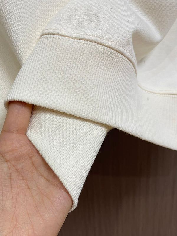 Close-up detail shot of Louis Vuitton luxury clothing with logo-detail design