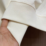 Close-up detail shot of Louis Vuitton luxury clothing with logo-detail design