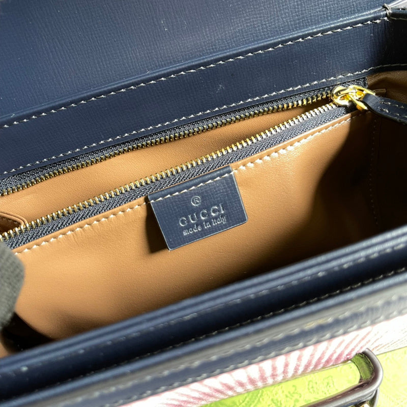 Side profile of signature polished women's handbag – women's luxury accessory