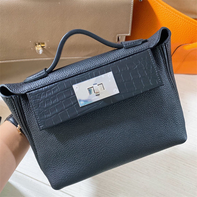  Clean-Lined top-handle bag carried on shoulder
