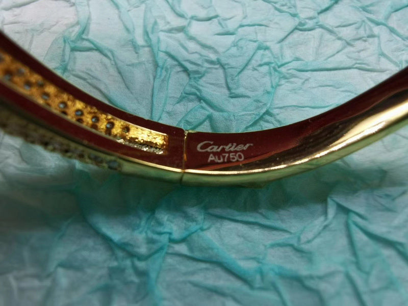 Close-up detail view of Cartier unisex jewelry piece