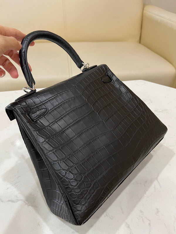 Side view of sleek structured handbag