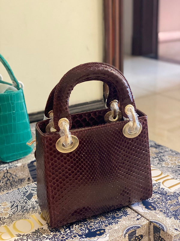 Styled lifestyle shot of polished sleek women's handbag – women's premium purse