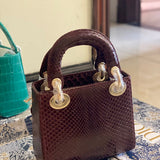 Styled lifestyle shot of polished sleek women's handbag – women's premium purse