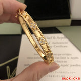 Lifestyle view of Van Cleef & Arpels unisex jewelry piece