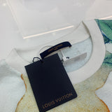 Flat lay presentation of Louis Vuitton luxury clothing with everyday silhouette