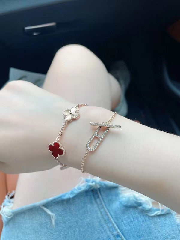 Lifestyle view of Van Cleef & Arpels unisex jewelry piece