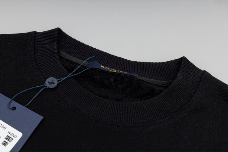 Close-up detail shot of Louis Vuitton luxury clothing with everyday silhouette