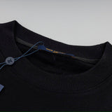 Close-up detail shot of Louis Vuitton luxury clothing with everyday silhouette