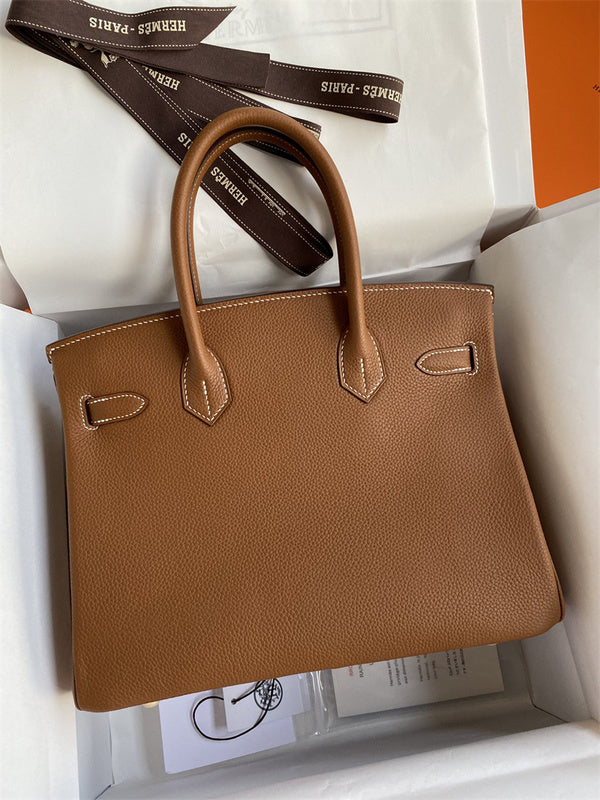 Side view of minimalist structured handbag