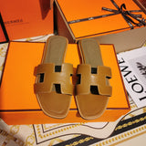 Hermès Red Flat Thong Sandals - Lifestyle Styling Shot