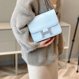 Side view of streamlined structured handbag