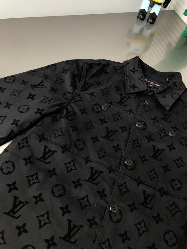 Side profile of Louis Vuitton luxury clothing with signature branding