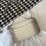 Side view of elegant structured handbag