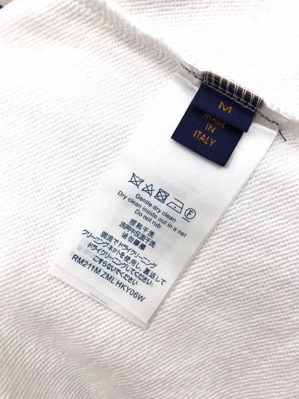 Side profile of Louis Vuitton luxury clothing with label-forward styling