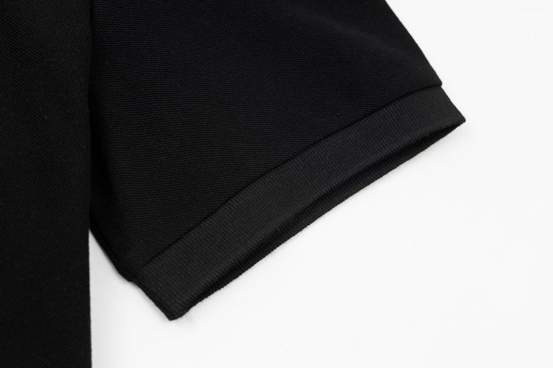Flat lay presentation of Polo cotton polo shirt with monogram-inspired silhouette
