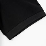 Flat lay presentation of Polo cotton polo shirt with monogram-inspired silhouette