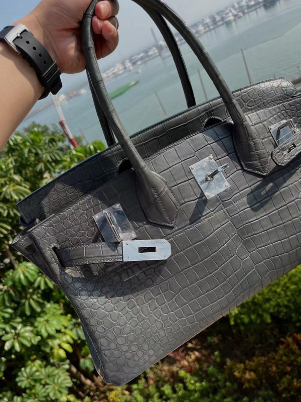 Side view of polished structured handbag