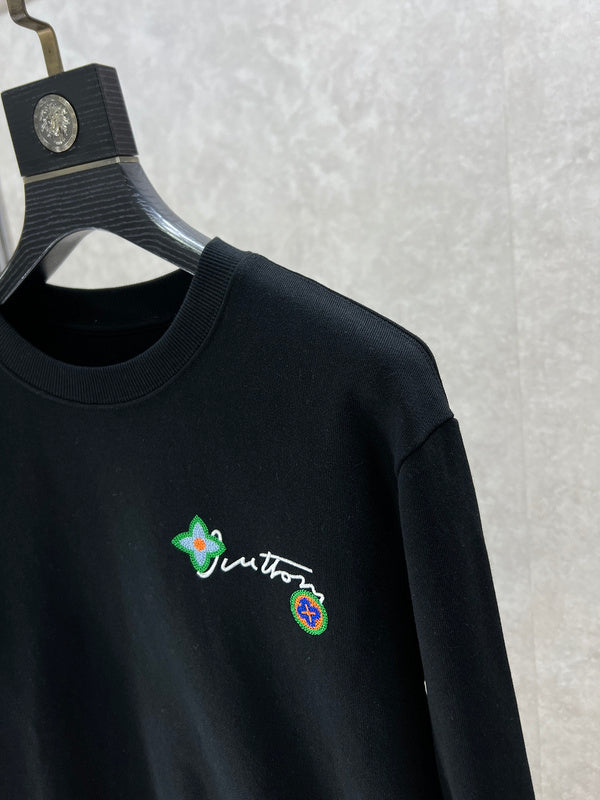 Full styled look of Louis Vuitton luxury clothing with logo-detail design