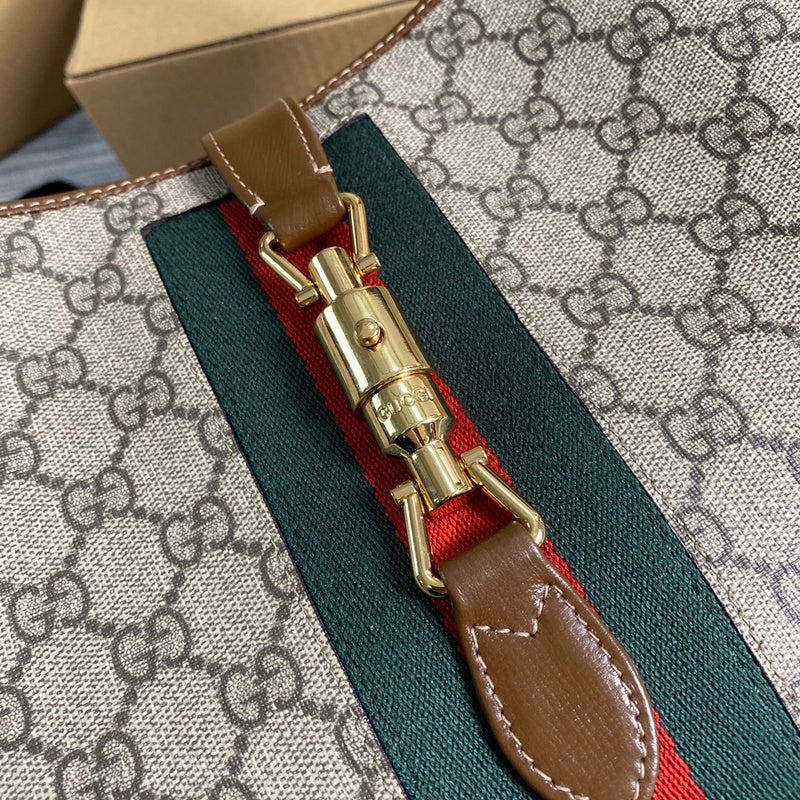 Handle and strap detail of everyday-luxe statement women's handbag – women's luxury handbag