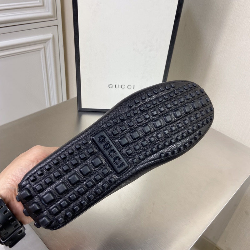Side profile of Gucci all-black sneakers retro runner design