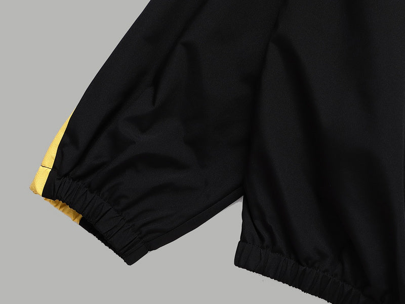 Flat lay presentation of Louis Vuitton luxury clothing with signature branding