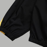 Flat lay presentation of Louis Vuitton luxury clothing with signature branding